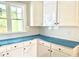 Modern kitchen showcasing white herringbone backsplash, sleek countertops, and ample cabinet space at 168 Clayton Rd, Princeton, NC 27569