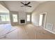 Bright living room showcasing a modern fireplace, light-filled windows, and spacious layout at 168 Clayton Rd, Princeton, NC 27569