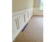 Close up on a room featuring traditional wainscoting and neutral wall color at 168 Clayton Rd, Princeton, NC 27569