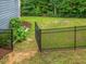 Fenced backyard offers a safe and private outdoor space with lush greenery and plenty of room to relax at 1804 Amberly Ledge Way, Cary, NC 27519