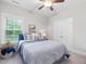 Cozy bedroom with a plush bed, a bright window, and ample closet space for comfortable living at 1804 Amberly Ledge Way, Cary, NC 27519
