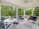Inviting outdoor deck with comfortable seating, perfect for relaxing and enjoying the surrounding greenery at 1804 Amberly Ledge Way, Cary, NC 27519