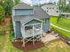 Aerial view of a two-story home with a covered deck, patio, and manicured landscaping at 1804 Amberly Ledge Way, Cary, NC 27519