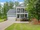 Charming two-story home with a two car garage and inviting double porches at 1804 Amberly Ledge Way, Cary, NC 27519