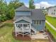 Aerial view of a two-story home with covered deck and patio at 1804 Amberly Ledge Way, Cary, NC 27519