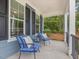 Cozy front porch featuring comfortable seating, providing a relaxing outdoor space at 1804 Amberly Ledge Way, Cary, NC 27519