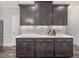 Modern kitchen island with stainless steel appliances and ample cabinet space at 1804 Amberly Ledge Way, Cary, NC 27519