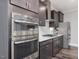 Stylish kitchen features built-in stainless oven, range, microwave, and stainless fridge at 1804 Amberly Ledge Way, Cary, NC 27519