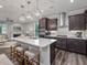 Bright kitchen features a large island with seating, stainless appliances, and modern lighting at 1804 Amberly Ledge Way, Cary, NC 27519