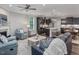 Open-concept living room featuring a modern kitchen, cozy seating area, and sleek hardwood floors at 1804 Amberly Ledge Way, Cary, NC 27519