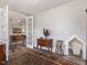 Cozy living room showcasing hardwood floors, stylish furniture, and unique architectural details at 1804 Amberly Ledge Way, Cary, NC 27519