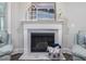 Living room with fireplace, bright natural light, and cozy furniture at 1804 Amberly Ledge Way, Cary, NC 27519