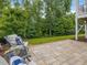Relaxing backyard patio space, complete with seating area at 1804 Amberly Ledge Way, Cary, NC 27519