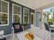 Inviting outdoor porch with comfortable seating and table, perfect for enjoying the outdoors at 1804 Amberly Ledge Way, Cary, NC 27519