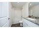 Bright bathroom featuring a granite-topped vanity, a modern sink, and a shower-tub combination at 200 Sweet Violet Dr, Youngsville, NC 27596