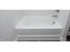 A close up of a white tub with brushed nickel fixtures in the bathroom at 200 Sweet Violet Dr, Youngsville, NC 27596