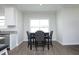 Eat in kitchen dining area with dark wood table and gray upholstered chairs at 200 Sweet Violet Dr, Youngsville, NC 27596