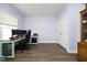 Well-lit office space with modern desk, hardwood floors, and a neutral color palette at 200 Sweet Violet Dr, Youngsville, NC 27596