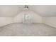 Spacious bonus room with neutral walls, carpet and good natural light at 2027 Hopeton Ave, Raleigh, NC 27614