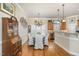 Dining room with wood floors and chandelier near the kitchen area at 2027 Hopeton Ave, Raleigh, NC 27614