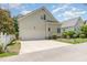Charming home featuring a spacious driveway and an attached two-car garage, complemented by well-maintained landscaping at 2027 Hopeton Ave, Raleigh, NC 27614