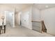 Upstairs hallway features neutral walls and carpet, with access to several rooms at 2027 Hopeton Ave, Raleigh, NC 27614