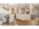 Open-concept kitchen with light wood cabinets, granite counters, and a breakfast nook at 2027 Hopeton Ave, Raleigh, NC 27614