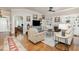 Cozy living room with hardwood floors, a fireplace, built-in shelving, and stylish decor throughout the room at 2027 Hopeton Ave, Raleigh, NC 27614