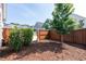 Spacious backyard with a young tree and wood fence, perfect for outdoor activities and privacy at 209 Stone River Dr, Wendell, NC 27591
