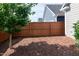Wide backyard with a full wooden fence, offering a secure and private outdoor space at 209 Stone River Dr, Wendell, NC 27591