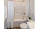 Bathroom featuring a shower/tub combo and vanity sink with a decorative mirror at 209 Stone River Dr, Wendell, NC 27591