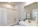 Bathroom featuring a shower/tub combo and vanity sink with decorative decor at 209 Stone River Dr, Wendell, NC 27591