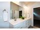 Bathroom with double sinks, closet, modern fixtures and large mirror at 209 Stone River Dr, Wendell, NC 27591