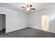 Bedroom featuring a ceiling fan, carpet flooring, and ensuite bathroom access at 209 Stone River Dr, Wendell, NC 27591