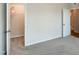 Bedroom with neutral carpet featuring an open closet and a neutral color palette at 209 Stone River Dr, Wendell, NC 27591
