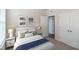 Bedroom featuring a Queen bed with art decor and two side tables with a view to the hallway at 209 Stone River Dr, Wendell, NC 27591