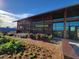 Modern commercial building with 'Welcome to the Farmhouse' sign and landscaped flower beds at 209 Stone River Dr, Wendell, NC 27591