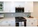 This modern kitchen features stainless steel appliances, a gas range, and updated countertops at 209 Stone River Dr, Wendell, NC 27591