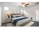 Bedroom featuring a ceiling fan, natural light, and ensuite bathroom access at 209 Stone River Dr, Wendell, NC 27591