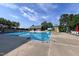 Community pool with a waterslide, lifeguard stand, and ample lounge seating for residents at 209 Stone River Dr, Wendell, NC 27591