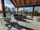 Outdoor lounge area with comfortable seating, overlooking the pool and scenic lake view at 209 Stone River Dr, Wendell, NC 27591