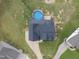 Drone shot of a pool in a backyard, complemented by lush greenery and landscaping at 241 Fox Run, Benson, NC 27504