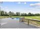 Beautiful backyard featuring an above ground pool and a large deck and green grass at 241 Fox Run, Benson, NC 27504