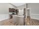 Updated kitchen features island with sink, granite countertops, and stainless steel appliances at 241 Fox Run, Benson, NC 27504