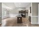 Modern kitchen featuring an island with a sink, stainless steel appliances, and granite countertops at 241 Fox Run, Benson, NC 27504