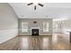Bright living room boasts hardwood floors, fireplace, and wainscoting detail, perfect for entertaining at 241 Fox Run, Benson, NC 27504