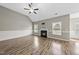 Comfortable living room with hardwood floors, fireplace, and vaulted ceiling for a modern touch at 241 Fox Run, Benson, NC 27504