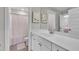 Bright bathroom with large vanity, shower/tub, and decorative accents at 243 E Wellesley Dr, Clayton, NC 27520