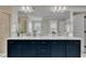 Stylish bathroom with double sinks, granite counters, and modern lighting at 243 E Wellesley Dr, Clayton, NC 27520