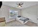 Neutral bedroom features a ceiling fan, window, and comfy bed at 243 E Wellesley Dr, Clayton, NC 27520